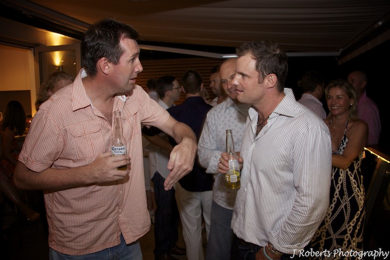 Giving instructions to Andrew Strauss - party photography sydney